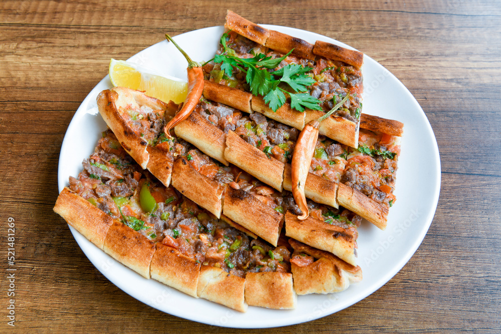 Turkish pita with minced cubed meat and cheese (Turkish name: Kiyma Kusbasi kasarli pide) Turkish pita with minced cubed meat and cheese (Turkish name: Kiyma Kusbasi kasarli pide)