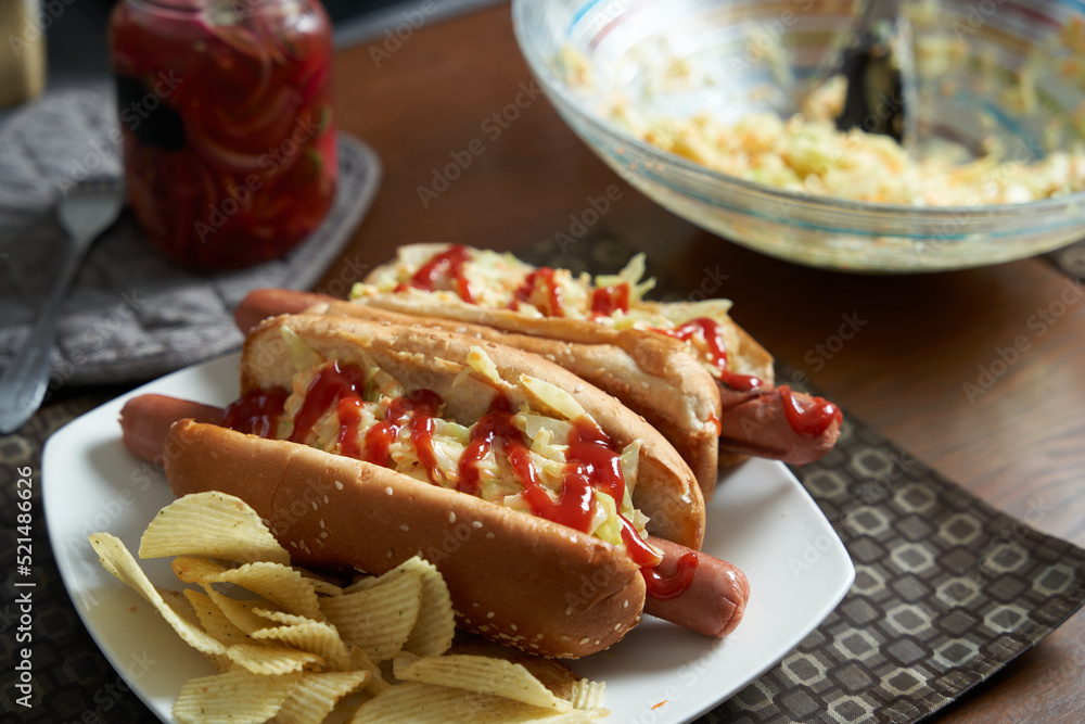 home made hot dogs with coleslaw and fries home made hot dogs with coleslaw and fries
