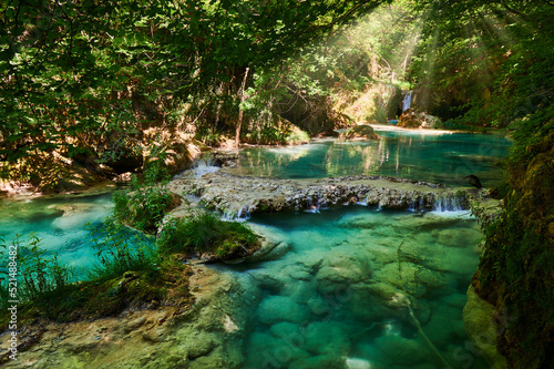 Turquoise waters in the Urederra river, Baquedano photo