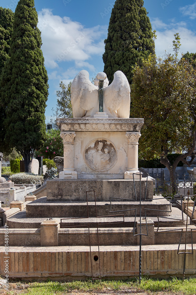 Fototapeta premium Figure of angel on his back in the cemetery of Sitges