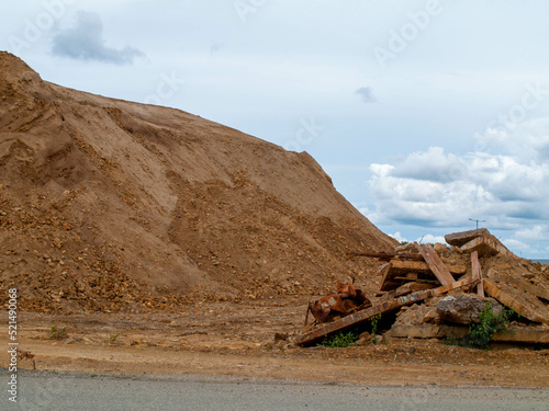 Fotografie Metallic rusty rubble pieces in Post Apocalyptic landscape with Falu Copper Mine