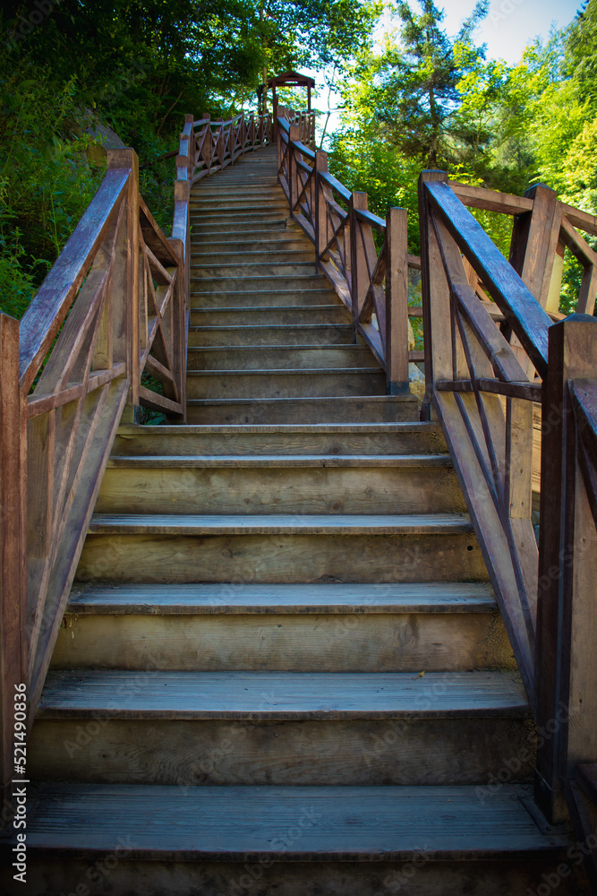 Long wooden stairs leading to the waterfall Long wooden stairs leading to the waterfall