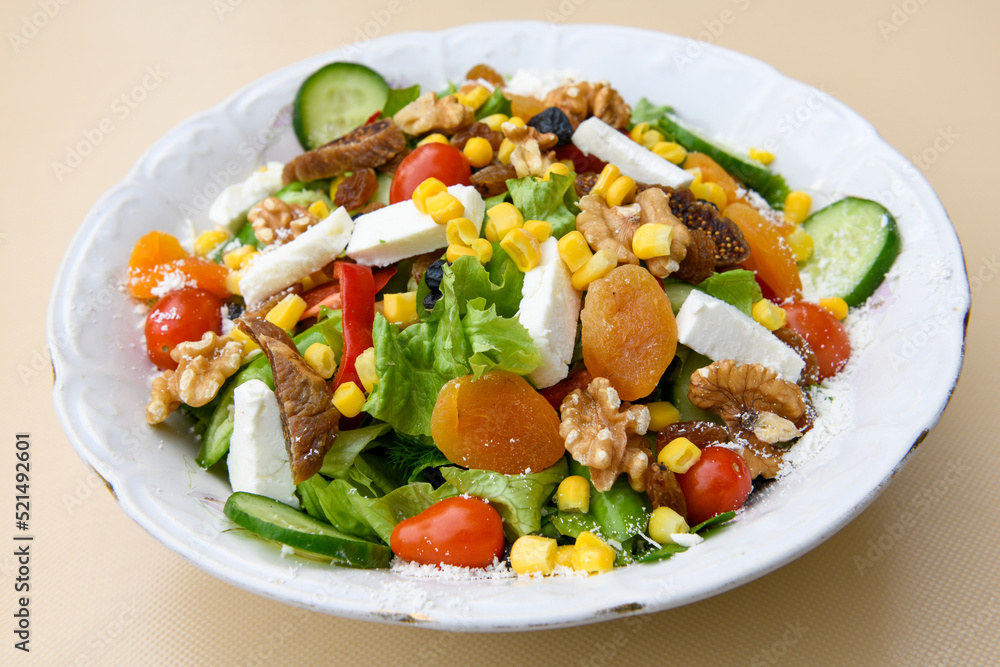 Green salad with arugula, lamb and tomatoes. Healthy vegan dish. Top view at table. Turkish Coban (choban) salata or Shepherds salad, Akdeniz salad in white bowl. Green salad with arugula, lamb and tomatoes. Healthy vegan dish. Top view at table. Turkish Coban (choban) salata or Shepherds salad, Akdeniz salad in white bowl.