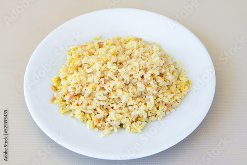 Traditional delicious Turkish food; Turkish style rice pilaf (Turkish name; Arpa sehriyeli. tavuklu, kuru fasulyeli, kavurmali pirinc pilavi) photo