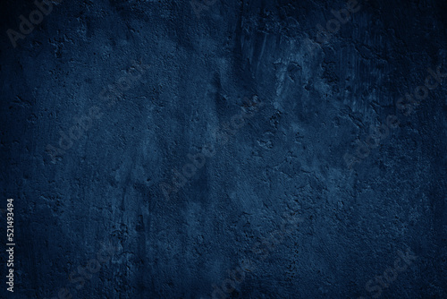 Navy blue texture. Close-up.Toned old concrete surface. Dark grunge background with space for design.