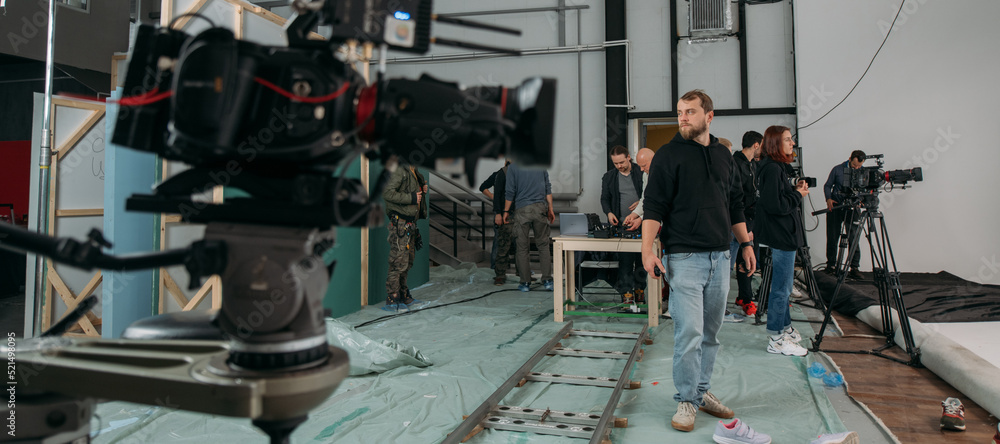 Film set, monitors and modern shooting equipment. Film crew, lighting devices, monitors, playbacks - filming equipment and a team Film set, monitors and modern shooting equipment. Film crew, lighting devices, monitors, playbacks - filming equipment and a team