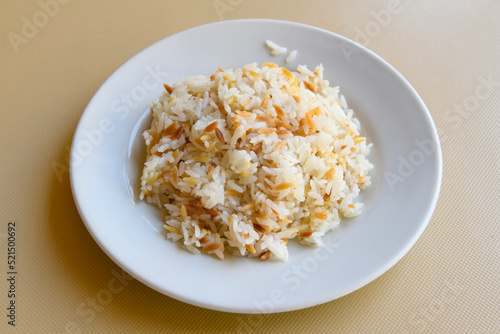 Traditional delicious Turkish food; Turkish style rice pilaf (Turkish name; Arpa sehriyeli. tavuklu, kuru fasulyeli, kavurmali pirinc pilavi) photo