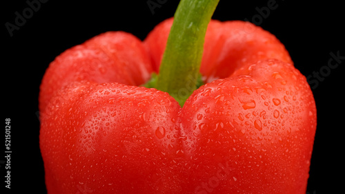 Sweet red bell pepper isolated on black background. Fresh paprika