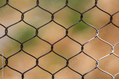 Stainless steel chain link fence mesh for high security enclosures.