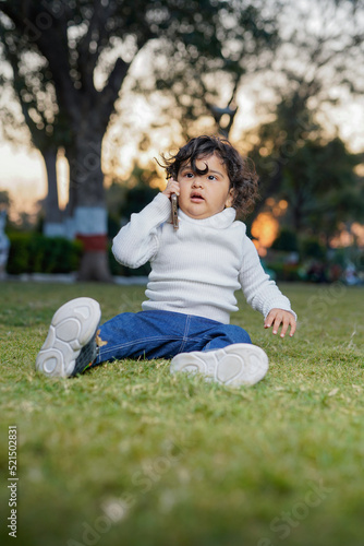 Cute indian little child at garden