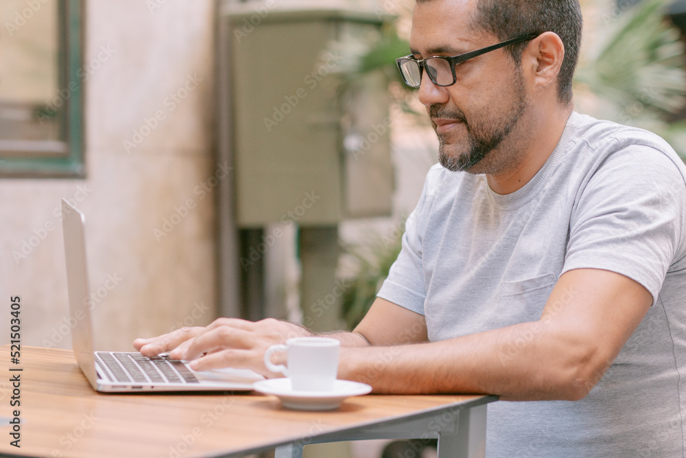 handsome man working with his laptop in cafe handsome man working with his laptop in cafe