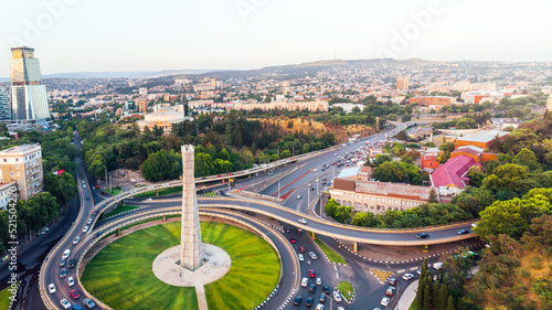 Tbilisi, Georgia - 15th july, 2022: static view automobiles in traffic on roundabout in Tbilisi center. Square of heroes monument © Evaldas