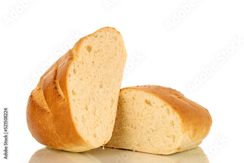 Two halves of a fragrant fresh long loaf, close-up, isolated on a white background.