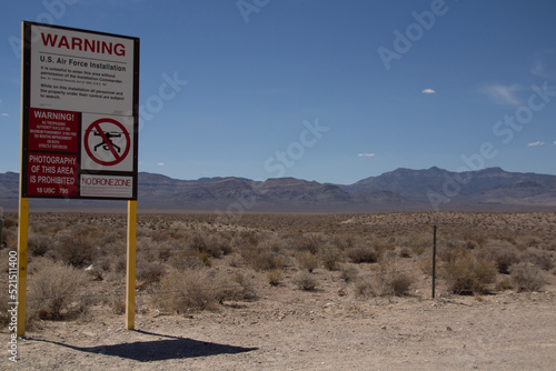 Area 51 Warning Keep Out Sign with Copy Space in the Blue Sky in Southern Nevada photo