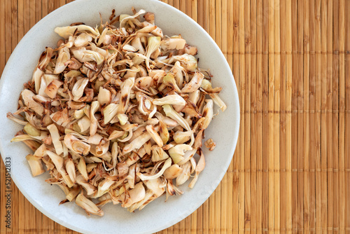 Canned jackfruit, shredded and roasted. Vegan food substitution for shredded meat. photo