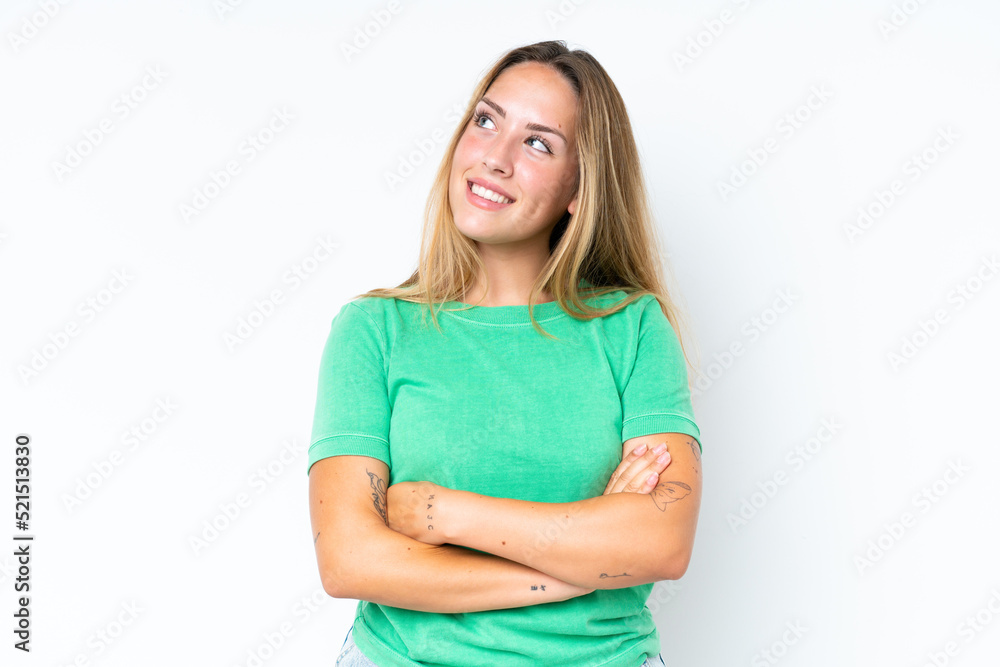 Young caucasian woman isolated on white background looking up while smiling Young caucasian woman isolated on white background looking up while smiling