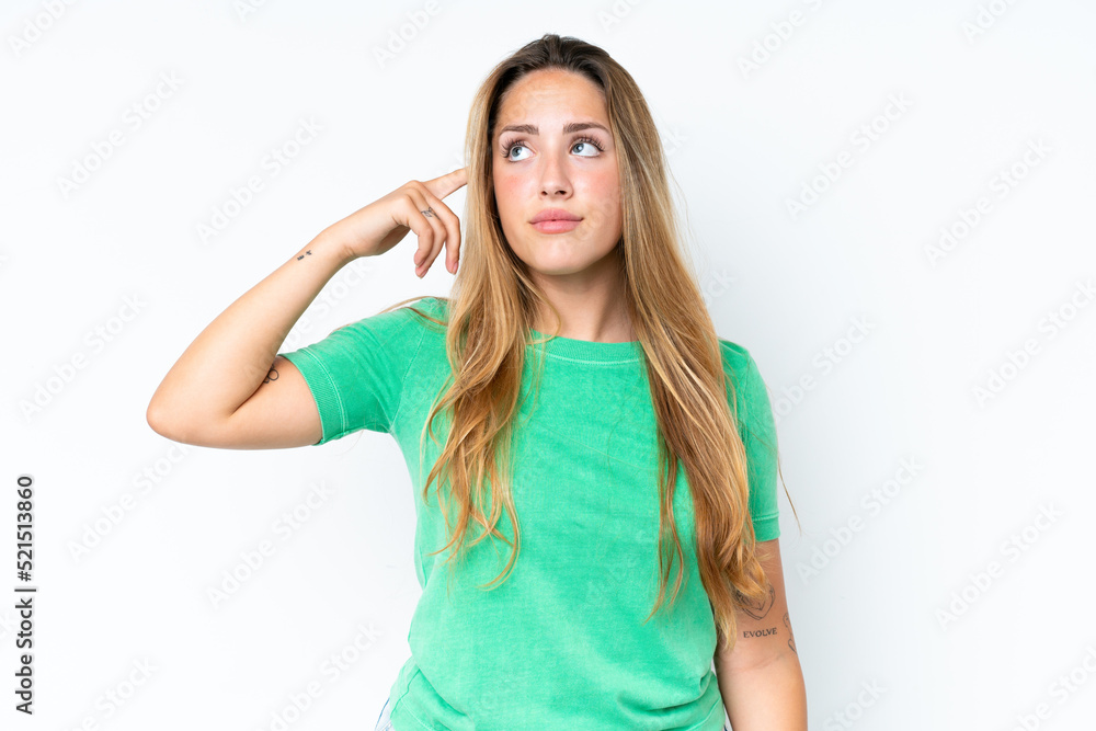 Young caucasian woman isolated on white background making the gesture of madness putting finger on the head Young caucasian woman isolated on white background making the gesture of madness putting finger on the head