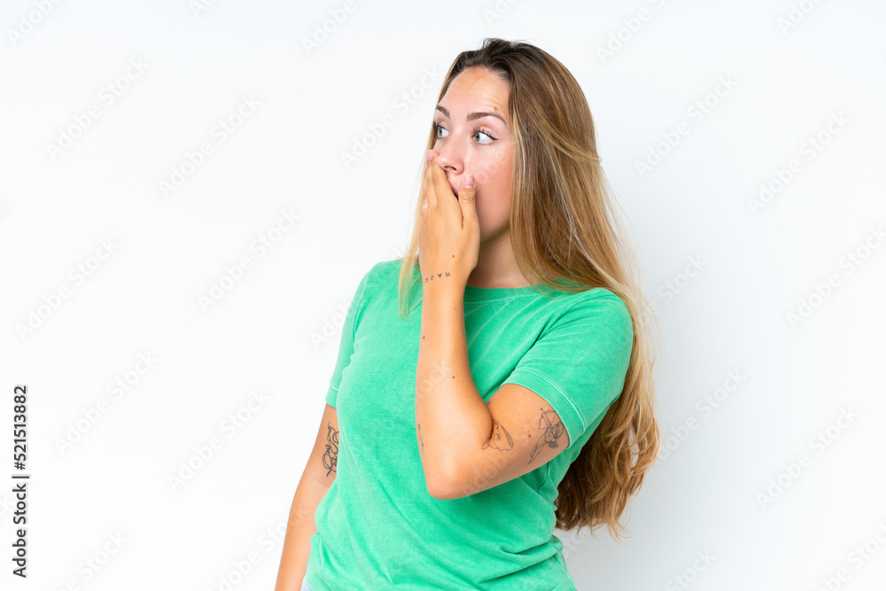 Young caucasian woman isolated on white background doing surprise gesture while looking to the side Young caucasian woman isolated on white background doing surprise gesture while looking to the side