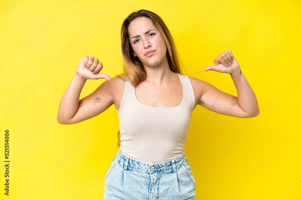 Young caucasian woman isolated on yellow background proud and self-satisfied Young caucasian woman isolated on yellow background proud and self-satisfied