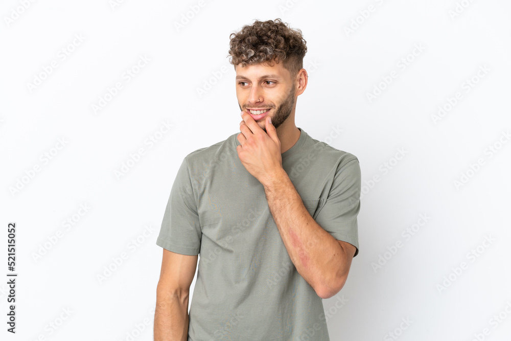 Young caucasian handsome man isolated on white background looking to the side and smiling Young caucasian handsome man isolated on white background looking to the side and smiling