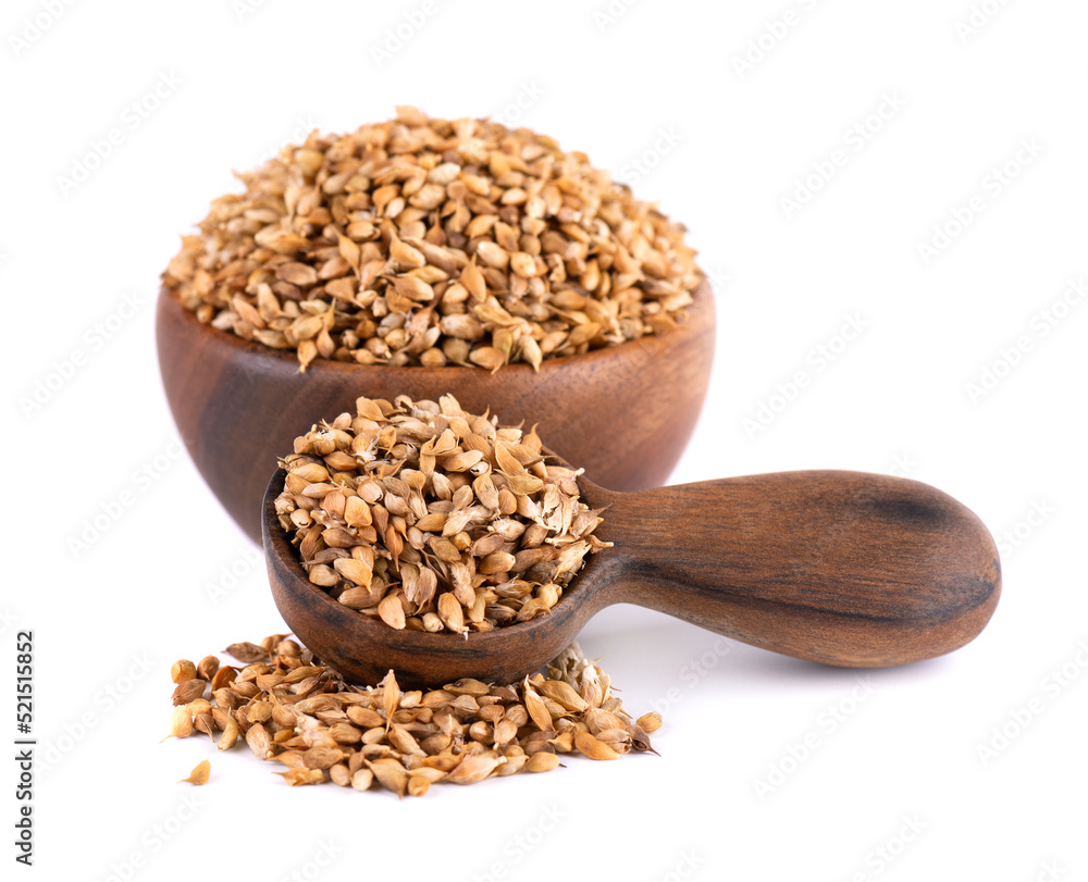Utsho suneli seeds in wooden bowl and spoon, isolated on white background. Trigonella caerulea or blue fenugreek. Utsho suneli seeds in wooden bowl and spoon, isolated on white background. Trigonella caerulea or blue fenugreek.