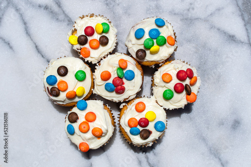 Vanilla Cupcakes with rainbow candies 