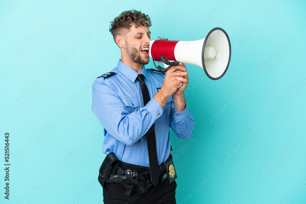Young police blonde man isolated white on blue background shouting through a megaphone Young police blonde man isolated white on blue background shouting through a megaphone