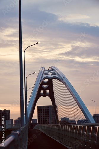 Vertical shot of the Chaotianmen Bridge with a road in Chongqing, China photo