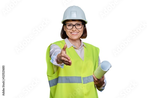 Canvas Print Female industrial worker in hardhat vest extending hand for handshake