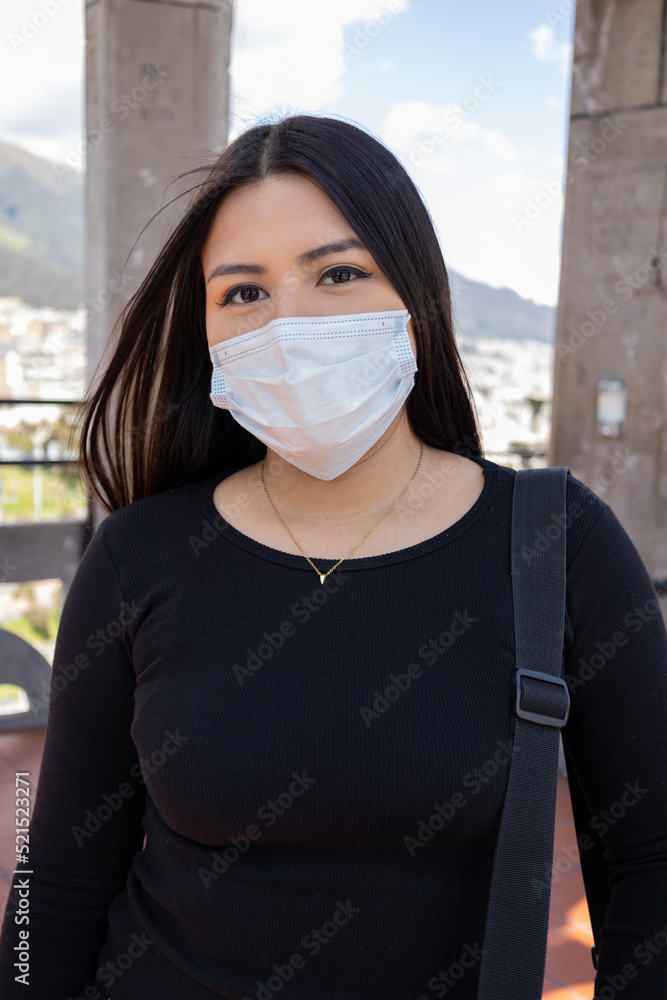 young woman with straight black hair wearing a face mask to prevent illness, latin model daytime beauty, modern lifestyle young woman with straight black hair wearing a face mask to prevent illness, latin model daytime beauty, modern lifestyle