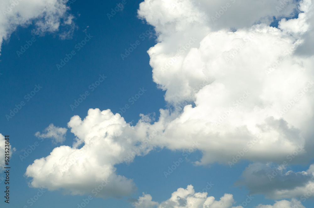 White clouds and blue sky on a sunny summer day White clouds and blue sky on a sunny summer day