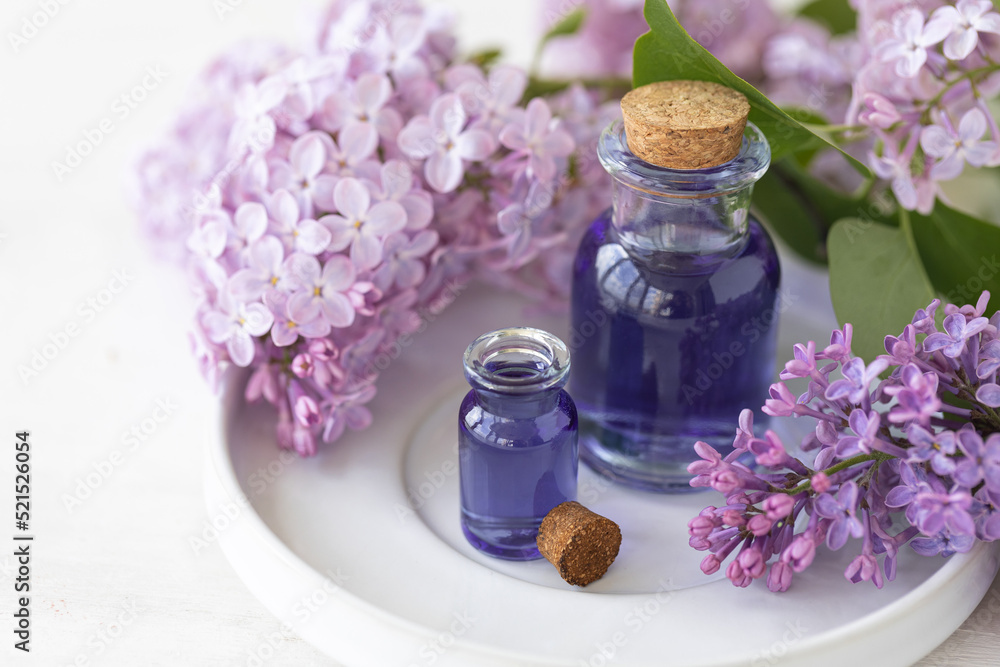 Concept of pure natural organic plant-based ingredients in cosmetology, herbal and flower extract. Lilac for anti-age and anti-acne therapy, gentle face and body skin care Concept of pure natural organic plant-based ingredients in cosmetology, herbal and flower extract. Lilac for anti-age and anti-acne therapy, gentle face and body skin care