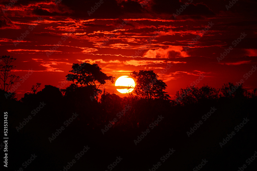 Red sunset on the wetlands of the Guaporé - Itenez river, near the remote village of Remanso, Beni Department, Bolivia, on the border with Rondonia state, Brazil
