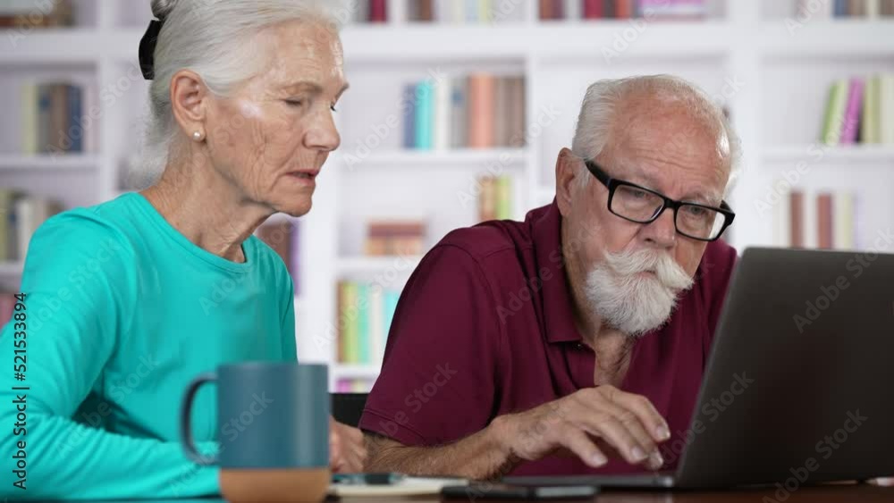 Elderly couple wife and husband frustrated in home office use laptop read bad news online tax return results, sale discounts, low price excited. Elderly couple wife and husband frustrated in home office use laptop read bad news online tax return results, sale discounts, low price excited.