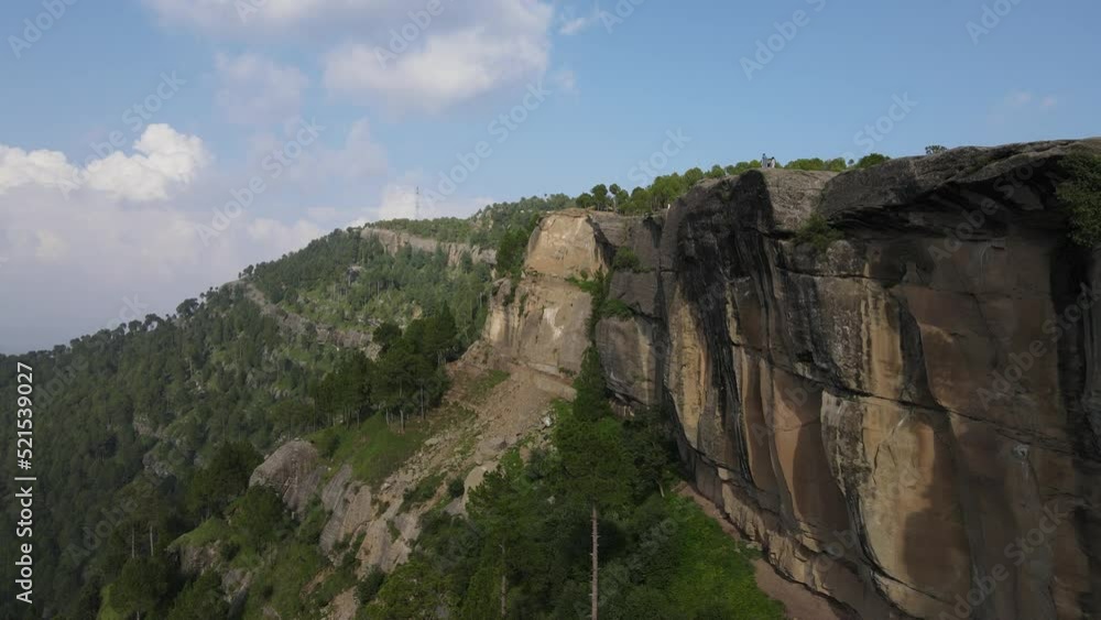 An aerial view of rocks and green forest, located on the mountains of Panj Peer An aerial view of rocks and green forest, located on the mountains of Panj Peer