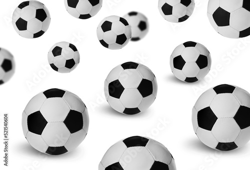 Falling new soccer balls on white background