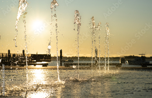 Canvas-taulu Water feature spraying waters in morning light