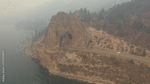 Lake Tahoe Covered in Thick Wildfire Smoke at Cave Rock - Aerial Rotating - 4K - 2021 photo