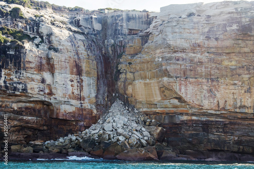 Rock falls and coastal cliffs below Wedding Cake Rock, Royal National Park Sydney Australia photo