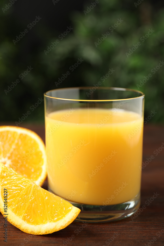 Glass of orange juice and fresh fruits on wooden table, closeup Glass of orange juice and fresh fruits on wooden table, closeup