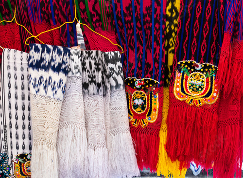 Scarves or makans from Ecuador at the market made using a technique called ikat and knitting. Traditional craft and design for Gualaceo canton, Azuay province. photo