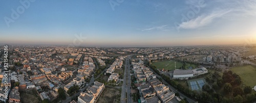 A beautiful aerial panorama of the rising sun over a housing society and its sports ground in Lahore, Pakistan.  © Abdul Wasiq
