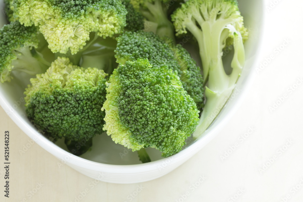 boiled cut prepared broccoli in white background with copy space boiled cut prepared broccoli in white background with copy space