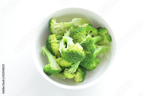 boiled cut prepared broccoli in white background with copy space