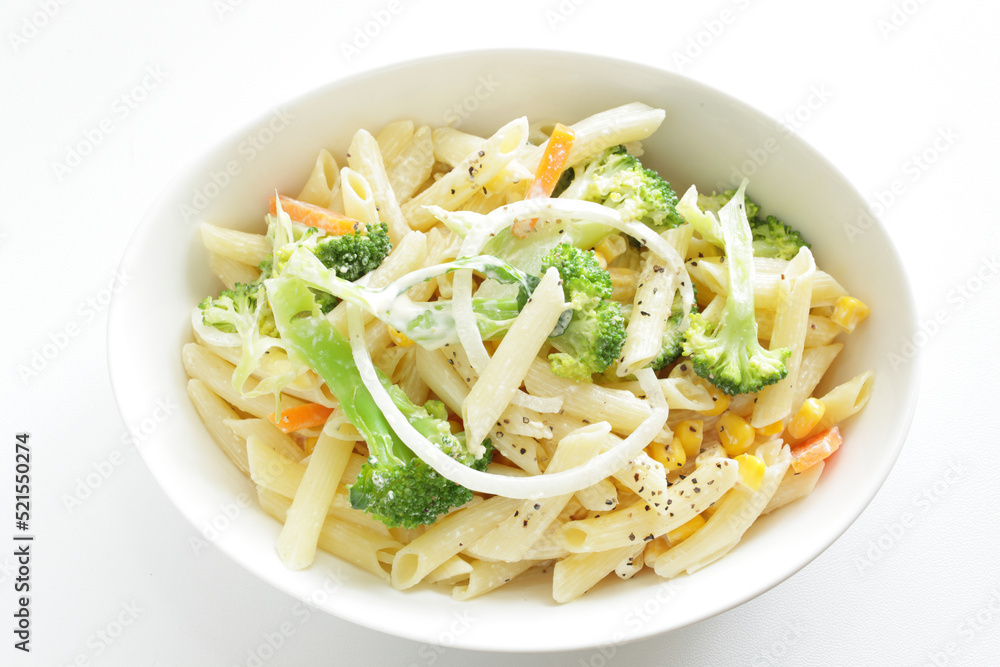 Homemade short pasta and broccoli salad with onion and carrot Homemade short pasta and broccoli salad with onion and carrot