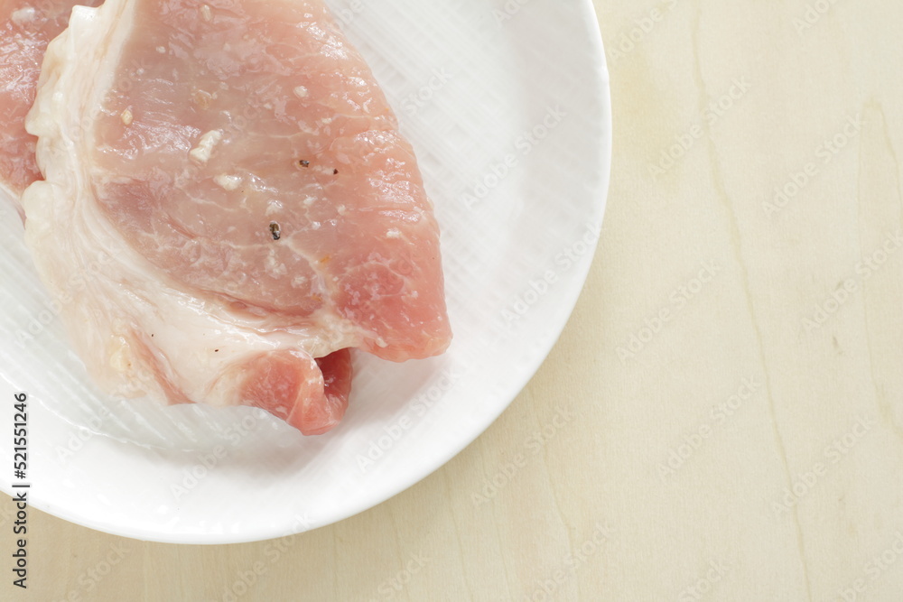 Prepared seasoning pepper and salt on sliced pork Prepared seasoning pepper and salt on sliced pork