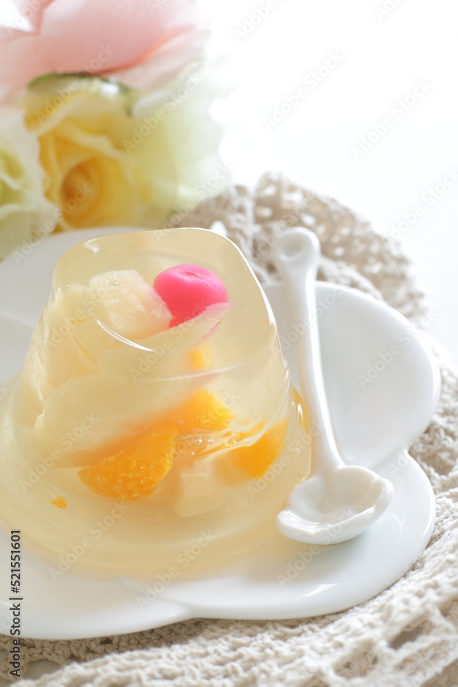 Mixed fruit Jelly on white dish with spoon for dessert image Mixed fruit Jelly on white dish with spoon for dessert image