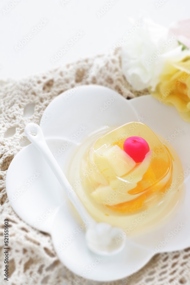 Mixed fruit Jelly on white dish with spoon for dessert image