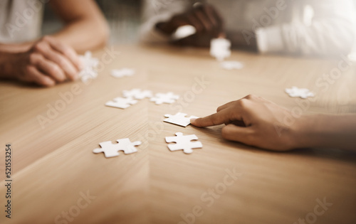 Business people brainstorming solution, problem solving and showing teamwork, working together on puzzle pieces. Team or smart business group activity for unity workflow in difficult corporate crisis