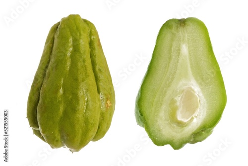 Whole and half chayote, scientific name Sechium edule, isolated on white background.